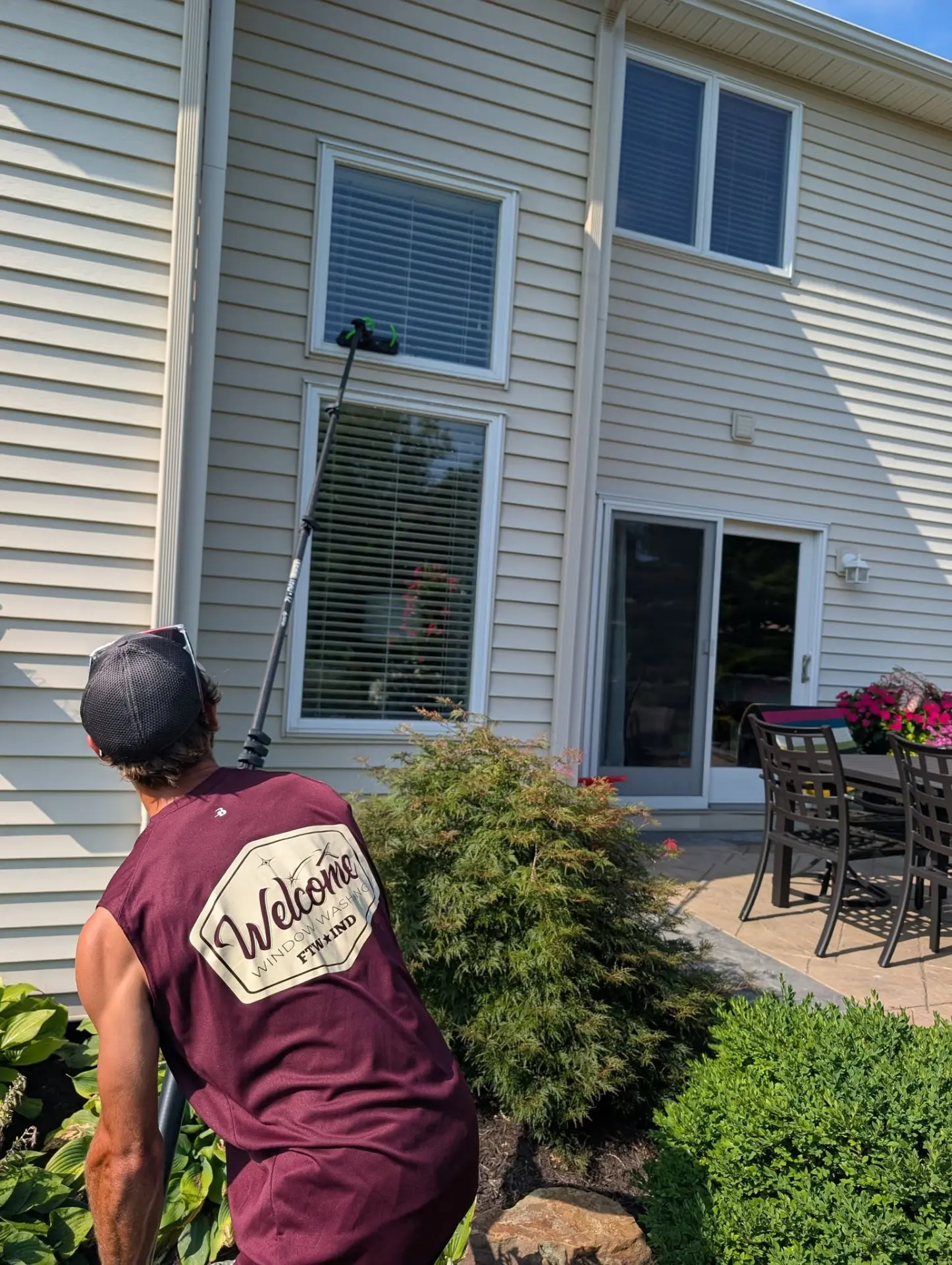 Cleaning residential windows with a water-fed pole