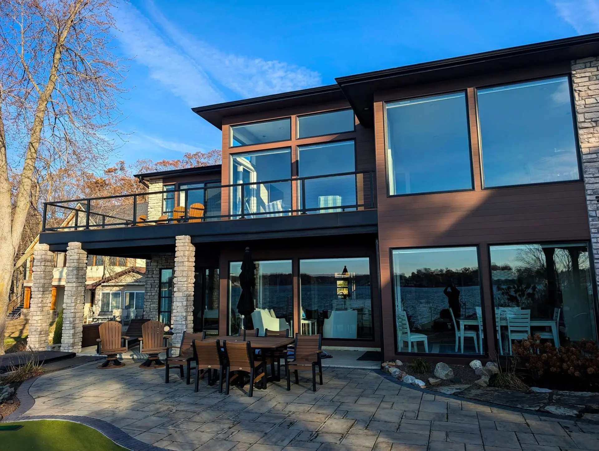 Spotless windows on a lakefront home at golden hour